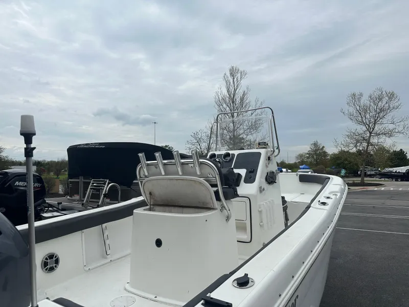 Slide: The Image of 2016 Clearwater 2200CC boat in parking lot, overcast sky, trees in background. - 3