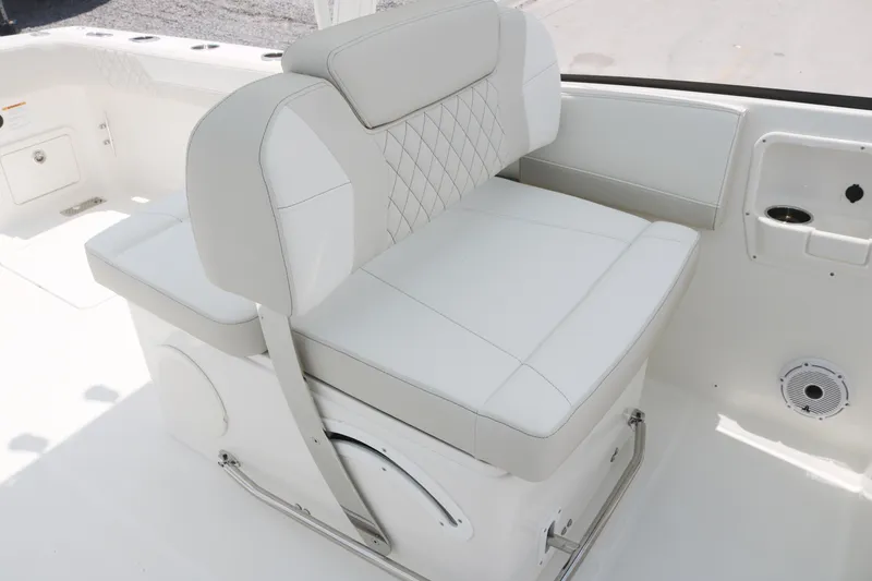 Slide: The Image of Luxury seating on 2025 World Cat 280 DC boat, featuring white cushioned upholstery. - 10