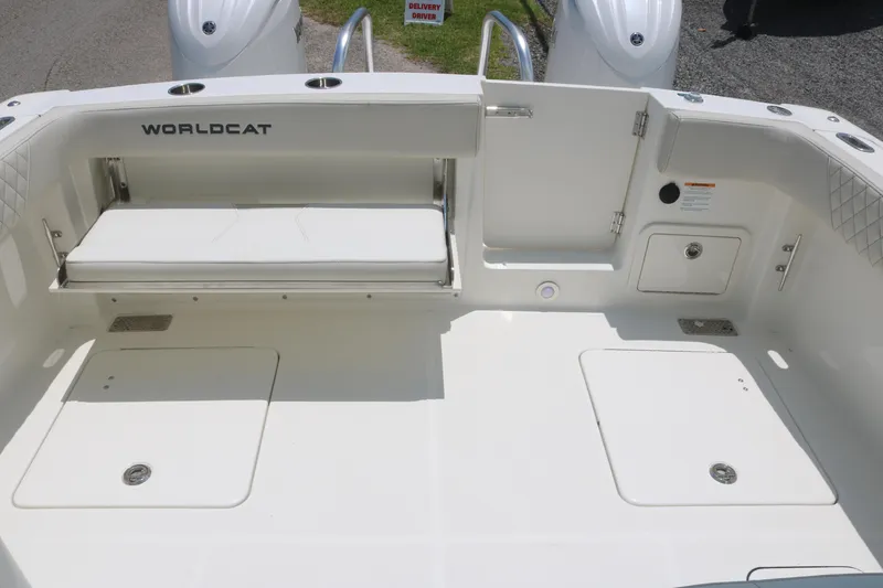 Slide: The Image of 2025 World Cat 280 DC boat deck with storage compartments and seating. - 14
