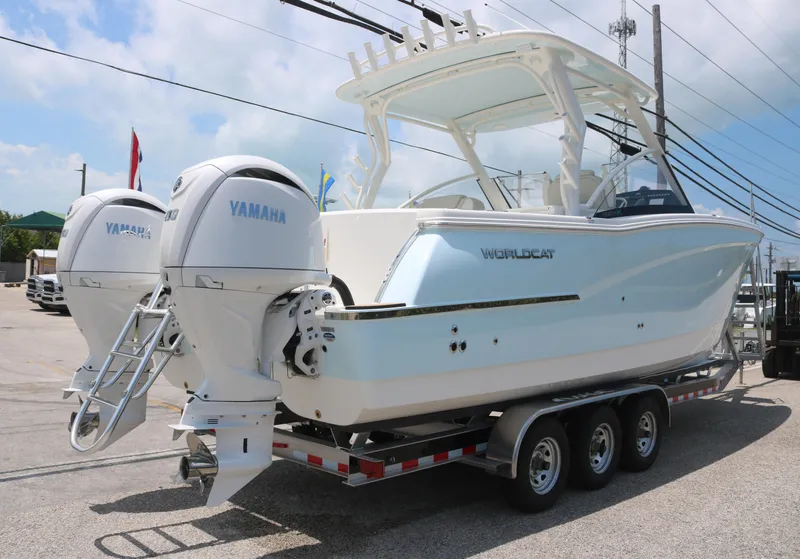 Slide: The Image of 2025 World Cat 280 DC boat with dual Yamaha engines on a trailer. - 3