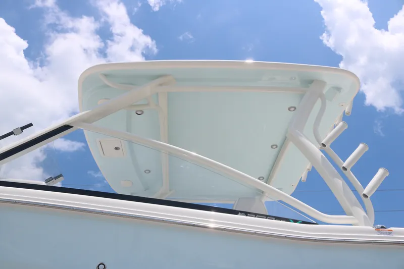Slide: The Image of 2025 World Cat 280 DC boat canopy against a bright blue sky. - 4