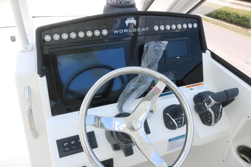 Slide: The Image of 2025 World Cat 280 DC dashboard with steering wheel and control panel. - 5