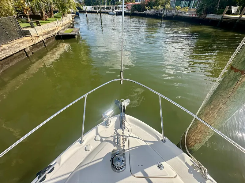 Slide: The Image of Bow view of 2008 Sea Ray 420 Sundancer in a calm waterway. - 18