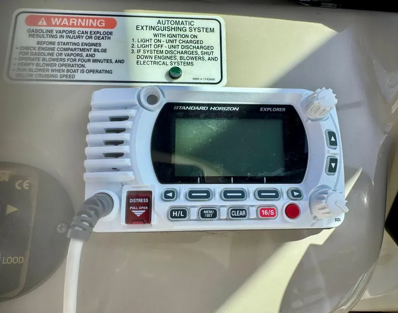 Slide: The Image of Standard Horizon Explorer radio on 2008 Sea Ray 340 Sundancer with safety warning label. - 29