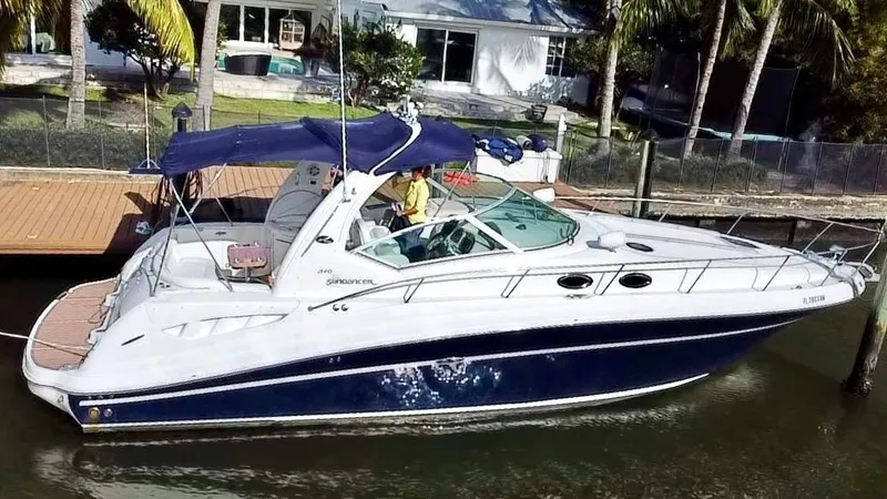 Slide: The Image of 2008 Sea Ray 420 Sundancer yacht docked by a waterfront home. - 3