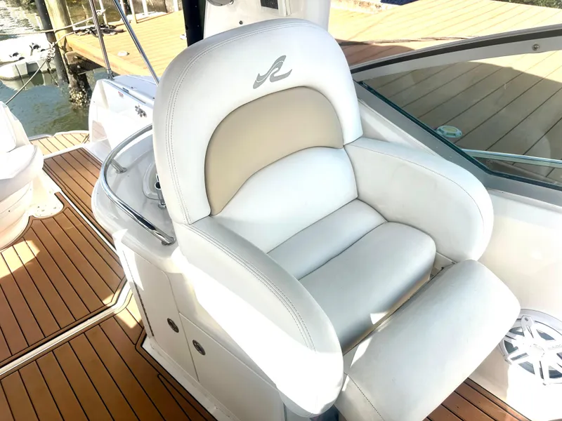 Slide: The Image of Luxurious white captain's chair on 2008 Sea Ray 420 Sundancer yacht, with teak flooring. - 35