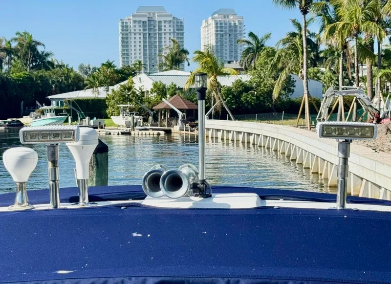 Slide: The Image of 2008 Sea Ray 340 Sundancer docked near waterfront with palm trees and buildings. - 39