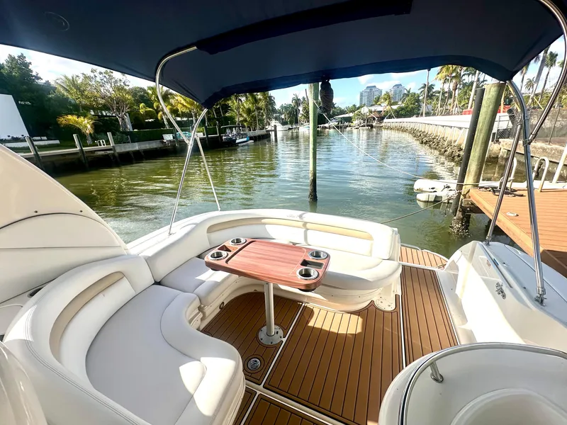 Slide: The Image of 2008 Sea Ray 420 Sundancer yacht with spacious deck, seating, and waterfront view. - 44