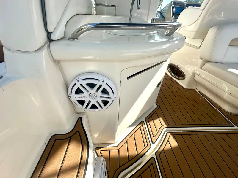 Slide: The Image of 2008 Sea Ray 420 Sundancer interior with teak flooring and built-in speaker. - 49