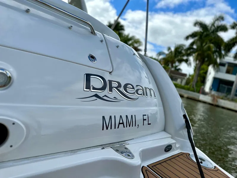 Slide: The Image of 2008 Sea Ray 340 Sundancer boat named "Dream" docked in Miami, Florida. - 52