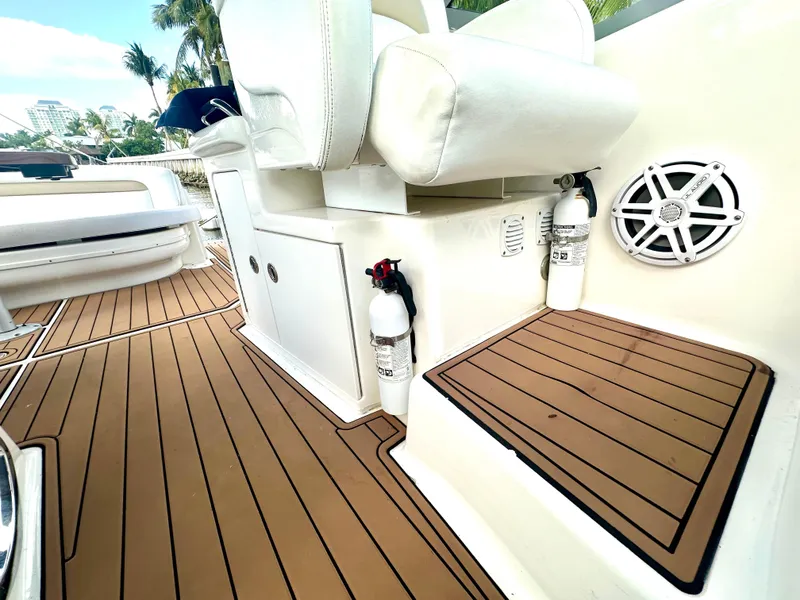 Slide: The Image of 2008 Sea Ray 420 Sundancer boat interior with teak flooring and white seating. - 53