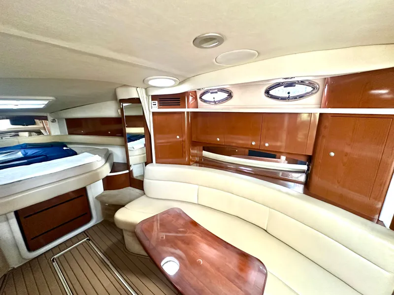 Slide: The Image of 2008 Sea Ray 420 Sundancer interior with elegant wood finish and plush seating. - 56