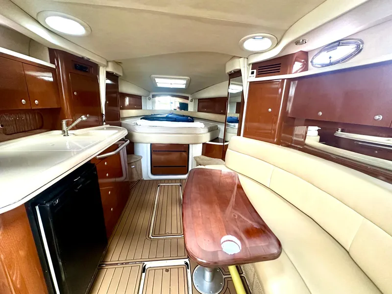 Slide: The Image of 2008 Sea Ray 420 Sundancer interior with wood finishes and modern amenities. - 57