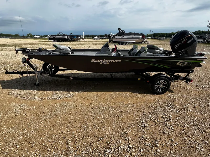 Slide: The Image of 2025 G3 Sportsman 1810 PFX boat on a trailer in a gravel lot. - 4