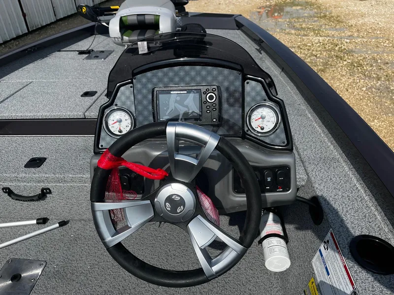 Slide: The Image of 2025 G3 Sportsman 1810 PFX boat dashboard with steering wheel and navigation display. - 8