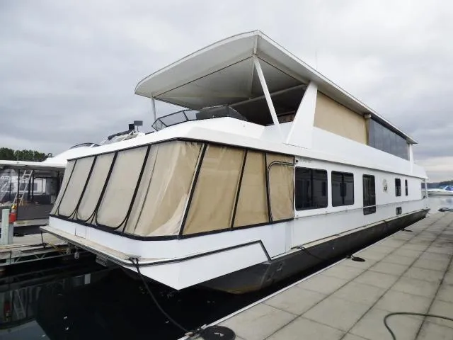 The Image of Houseboat docked at marina, Stardust Cruisers 18x83 model, year 2000, with covered upper deck. - 0