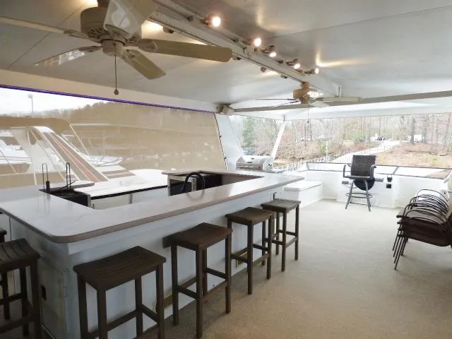 Slide: The Image of Spacious outdoor deck on 2000 Stardust Cruisers 18x83 houseboat with bar and seating area. - 11