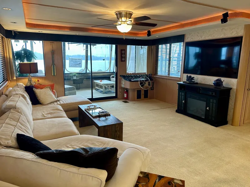 Slide: The Image of Luxurious living area in 2000 Stardust Cruisers 18x83 houseboat with modern amenities. - 2