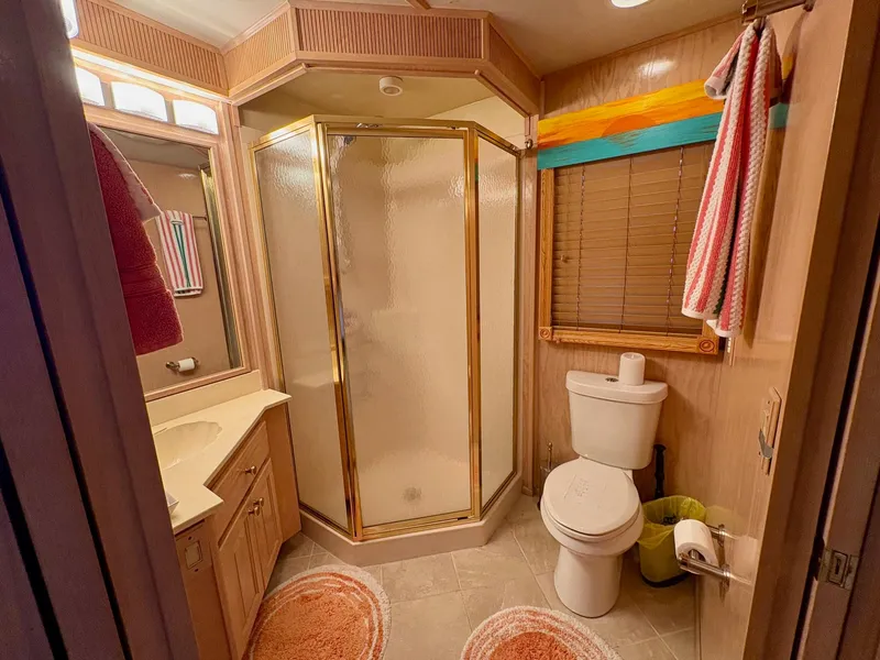 Slide: The Image of Bathroom interior of 2000 Stardust Cruisers 18x83 houseboat with shower and toilet. - 8