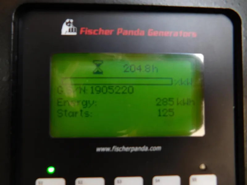 Slide: The Image of Fischer Panda generator display showing 2048 hours, 285 kWh energy, 125 starts. Grady-White Freedom 375. - 10