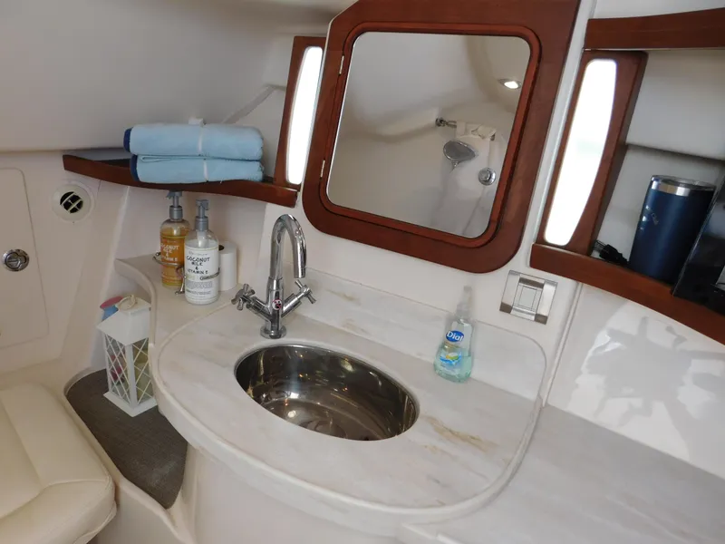 Slide: The Image of Luxurious bathroom interior of 2018 Grady-White Freedom 375 boat with sink and mirror. - 14