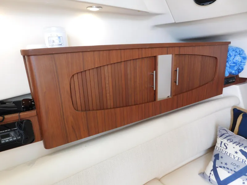 Slide: The Image of Wooden cabinet interior of 2018 Grady-White Freedom 375 boat, featuring sleek design and modern finish. - 20