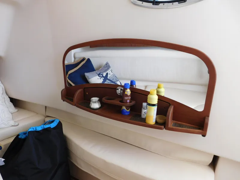 Slide: The Image of 2018 Grady-White Freedom 375 cabin interior with wooden shelf and seating area. - 21