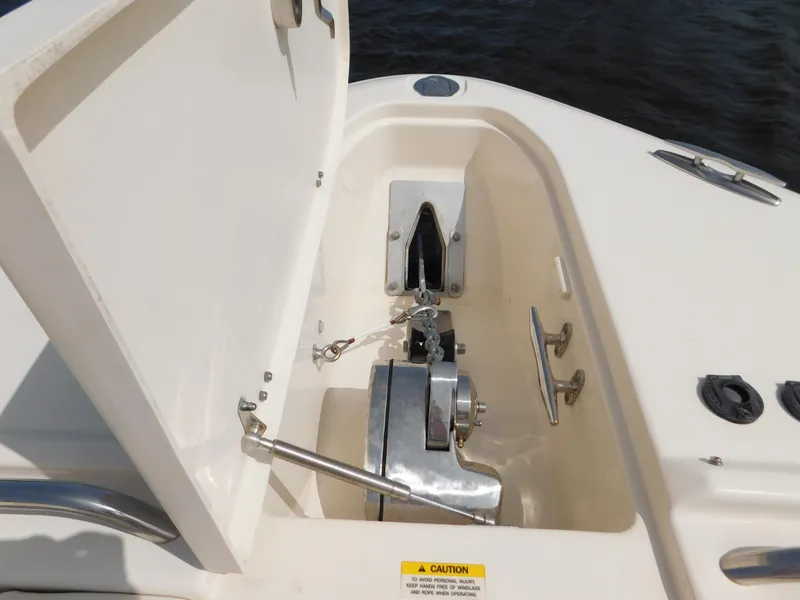 Slide: The Image of Anchor compartment of 2018 Grady-White Freedom 375 boat, open hatch, marine equipment visible. - 27