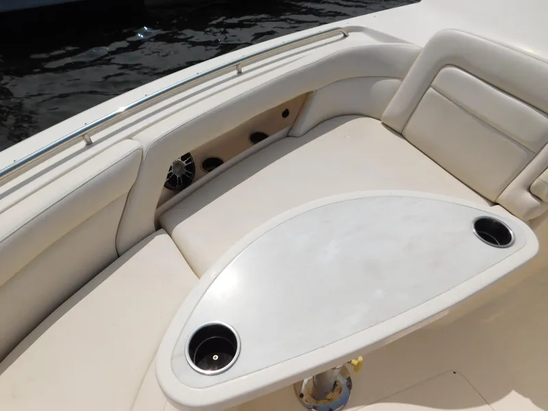 Slide: The Image of 2018 Grady-White Freedom 375 boat interior with cushioned seating and table. - 28