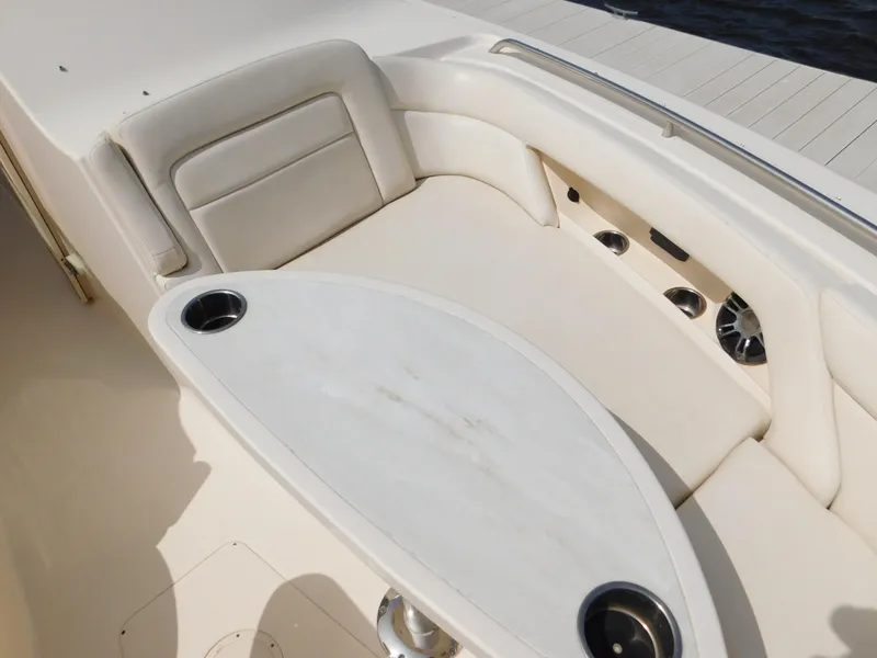 Slide: The Image of 2018 Grady-White Freedom 375 boat interior with cushioned seating and cup holders. - 29