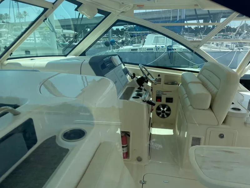 Slide: The Image of 2018 Grady-White Freedom 375 boat interior with helm and seating area. - 7