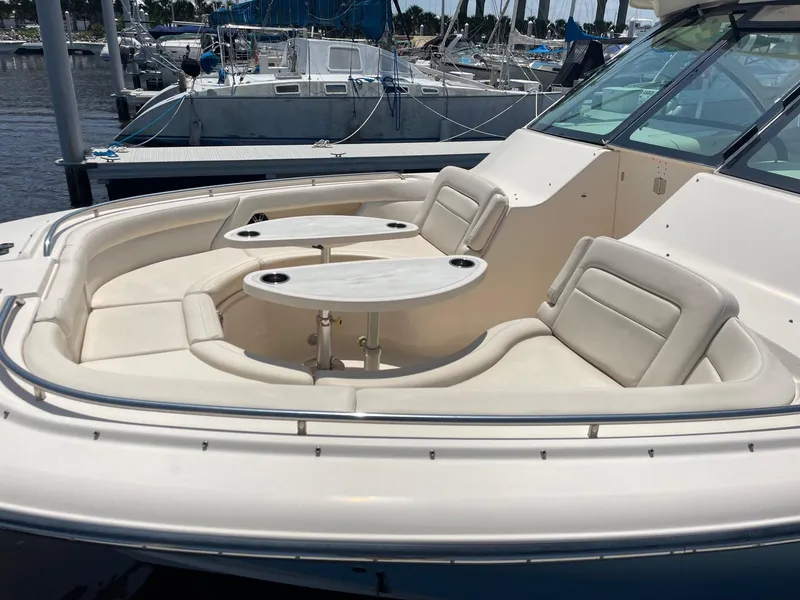 Slide: The Image of 2018 Grady-White Freedom 375 boat with spacious seating and dual tables at a marina. - 8