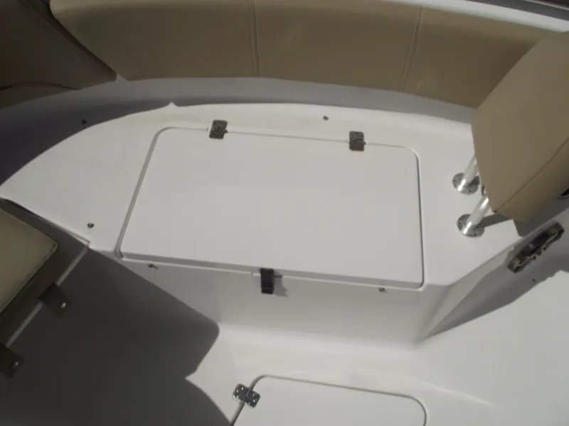 Slide: The Image of 2016 Sportsman Open 232 Center Console boat interior with storage compartment. - 17