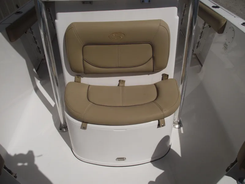 Slide: The Image of 2016 Sportsman Open 232 Center Console boat seating area with tan cushions. - 19