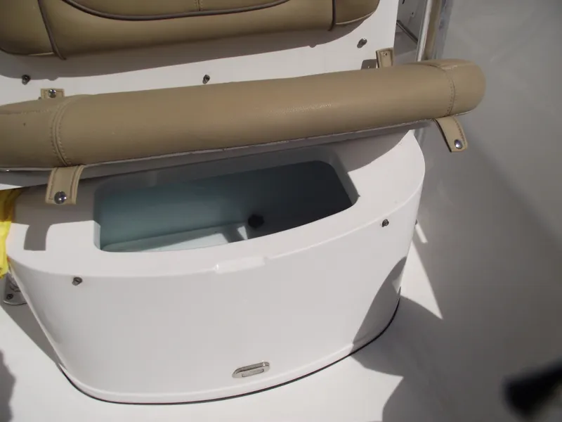 Slide: The Image of 2016 Sportsman Open 232 Center Console boat seat with storage compartment. - 20