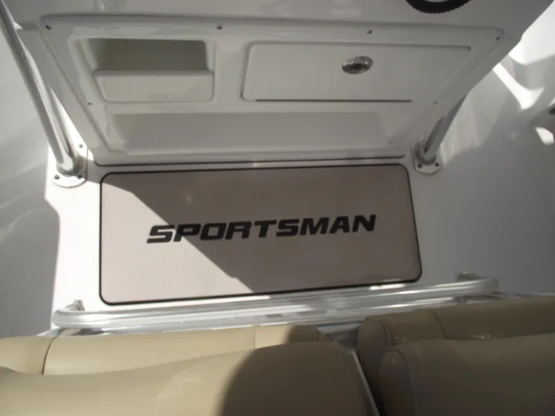 Slide: The Image of 2016 Sportsman Open 232 Center Console interior with logo and storage compartments. - 25