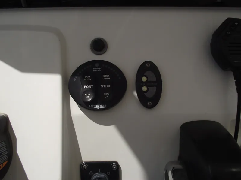 Slide: The Image of Control panel of a 2016 Sportsman Open 232 Center Console boat. - 31