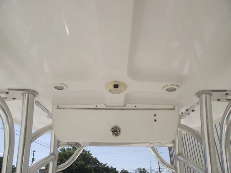 Slide: The Image of 2016 Sportsman Open 232 Center Console T-top with rod holders and lighting fixtures. - 32