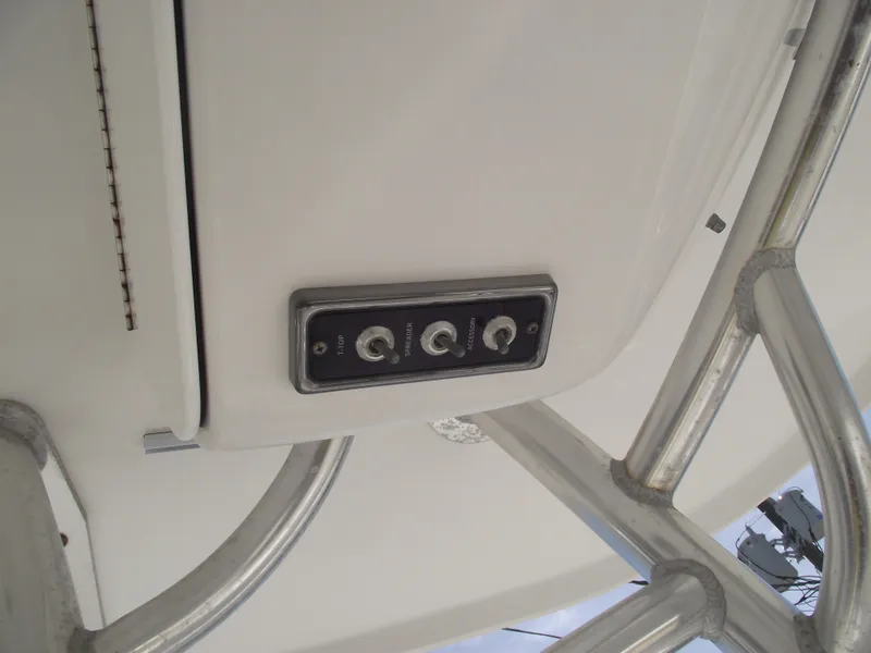 Slide: The Image of 2016 Sportsman Open 232 Center Console switch panel on boat's interior ceiling. - 34