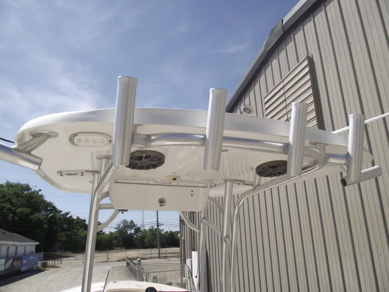 Slide: The Image of 2016 Sportsman Open 232 Center Console boat's T-top with rod holders and speakers. - 35