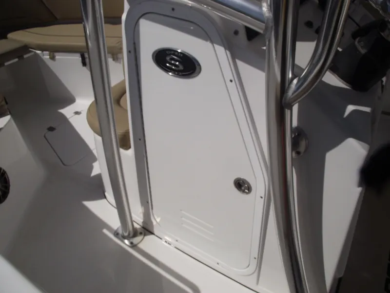 Slide: The Image of 2016 Sportsman Open 232 Center Console interior with white panel and stainless steel accents. - 38
