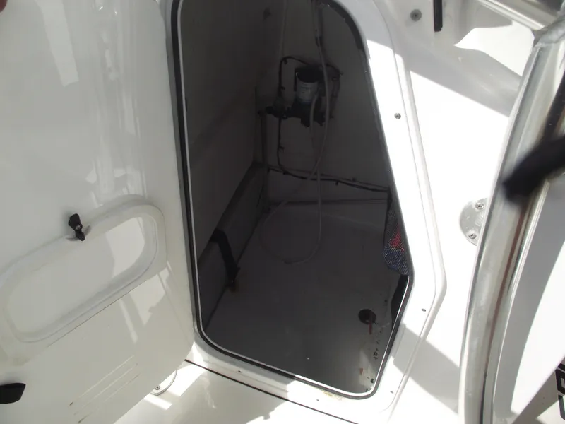 Slide: The Image of 2016 Sportsman Open 232 Center Console storage compartment interior view. - 39