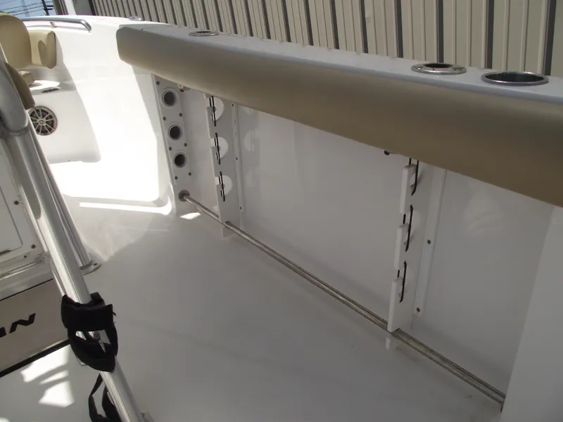 Slide: The Image of 2016 Sportsman Open 232 Center Console interior with rod holders and seating. - 41