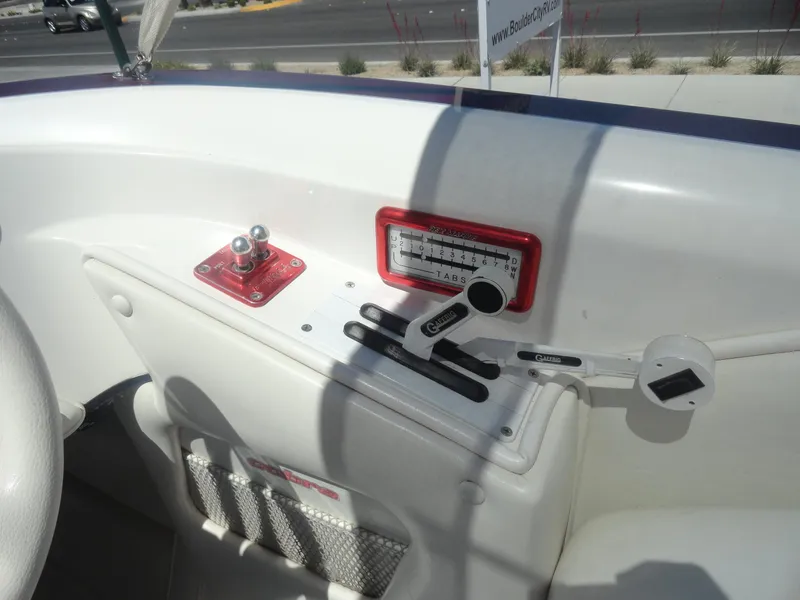Slide: The Image of Control panel of a 2003 Cobra 270 Razor Mid-Cabin Open Bow boat. - 10