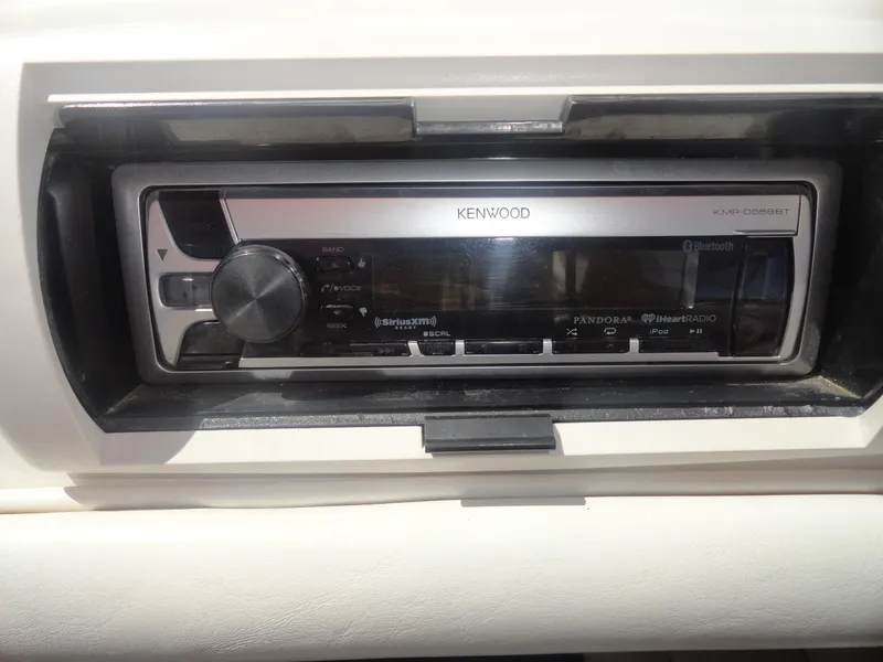 Slide: The Image of Kenwood stereo system in 2003 Cobra 270 Razor Mid-Cabin Open Bow boat. - 16