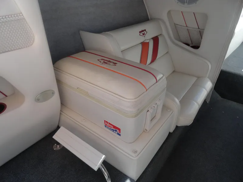 Slide: The Image of 2003 Cobra 270 Razor Mid-Cabin Open Bow interior with white and red seating. - 18