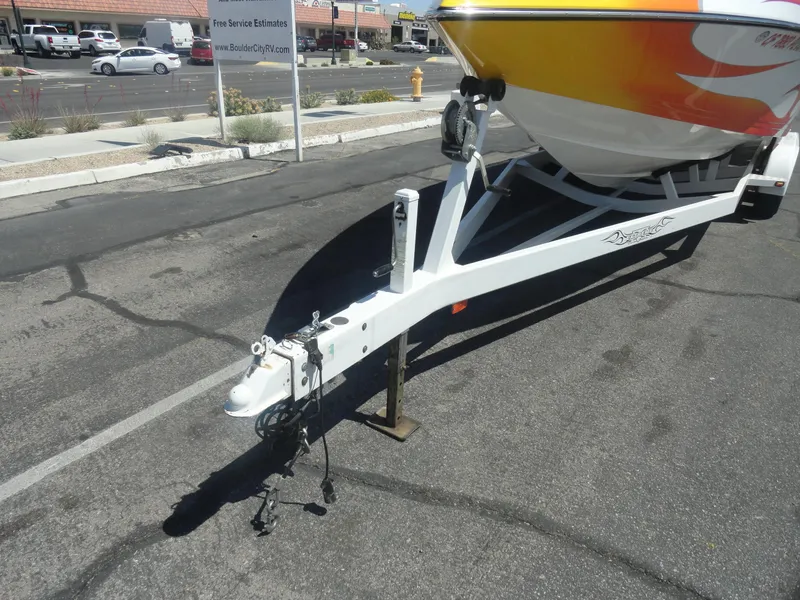 Slide: The Image of 2003 Cobra 270 Razor boat trailer hitch in parking lot. - 23