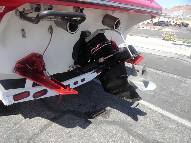 Slide: The Image of Rear view of a 2003 Cobra 270 Razor boat showing propeller and trim tabs. - 26