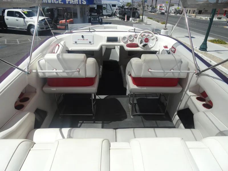 Slide: The Image of 2003 Cobra 270 Razor Mid-Cabin Open Bow boat interior with white and red seating. - 6