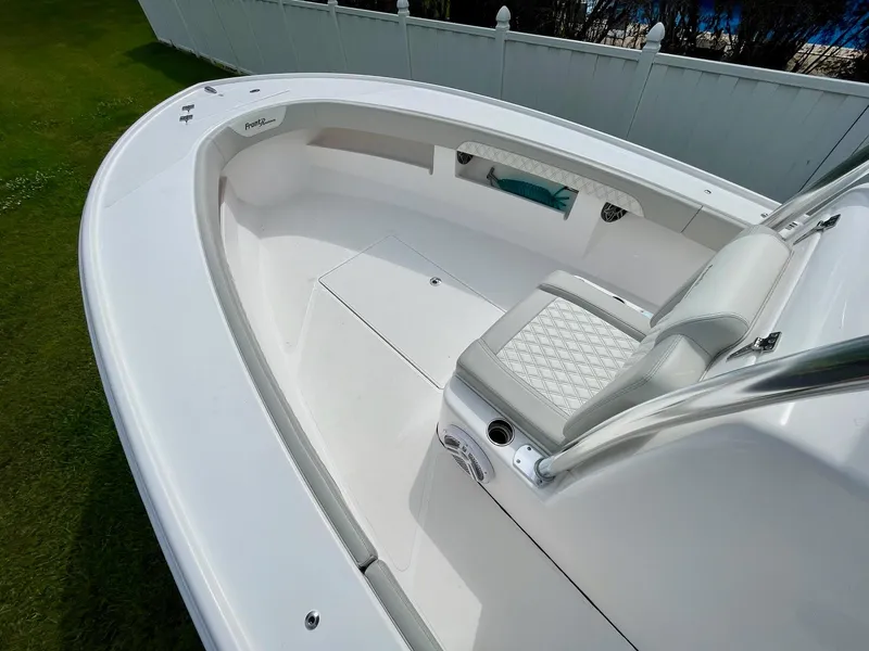 Slide: The Image of 2022 Front Runner 26 Center Console boat with sleek white interior and seating. - 11